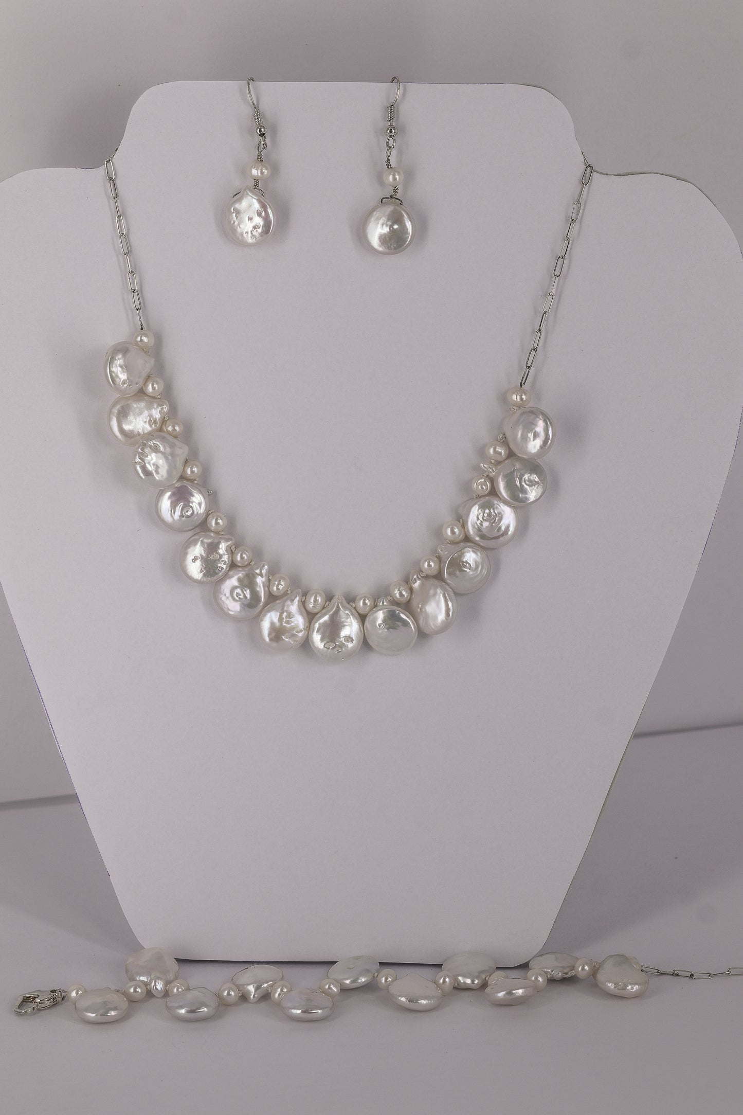 Fresh water pearl sterling silver .925 necklace paired with matching earrings and bracelet.  Necklace – 16” or 41cm  Bracelet -7” or 19 cm